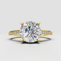 Round diamond hidden halo engagement ring with four-prong setting and pavé band.