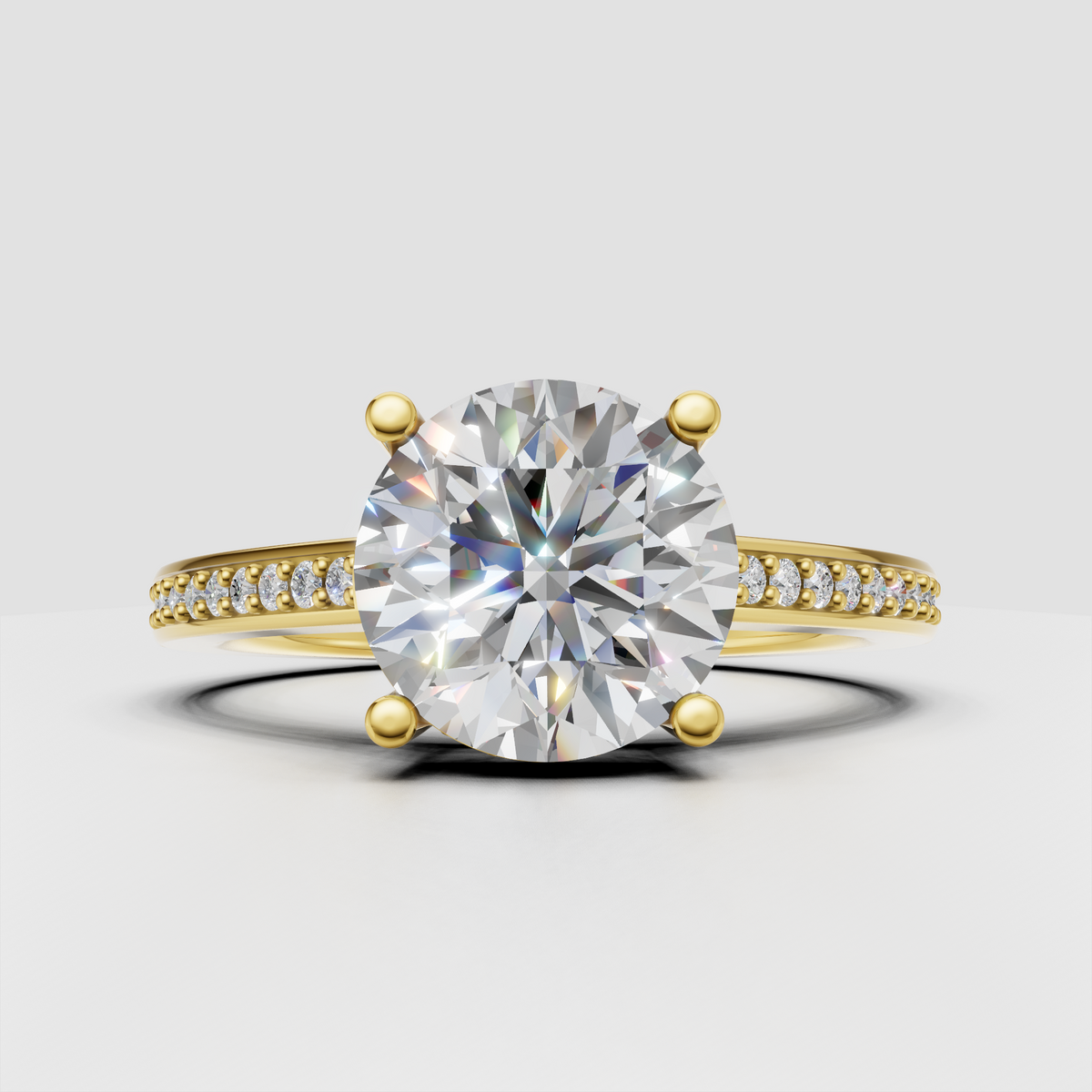 Round diamond hidden halo engagement ring with four-prong setting and pavé band.