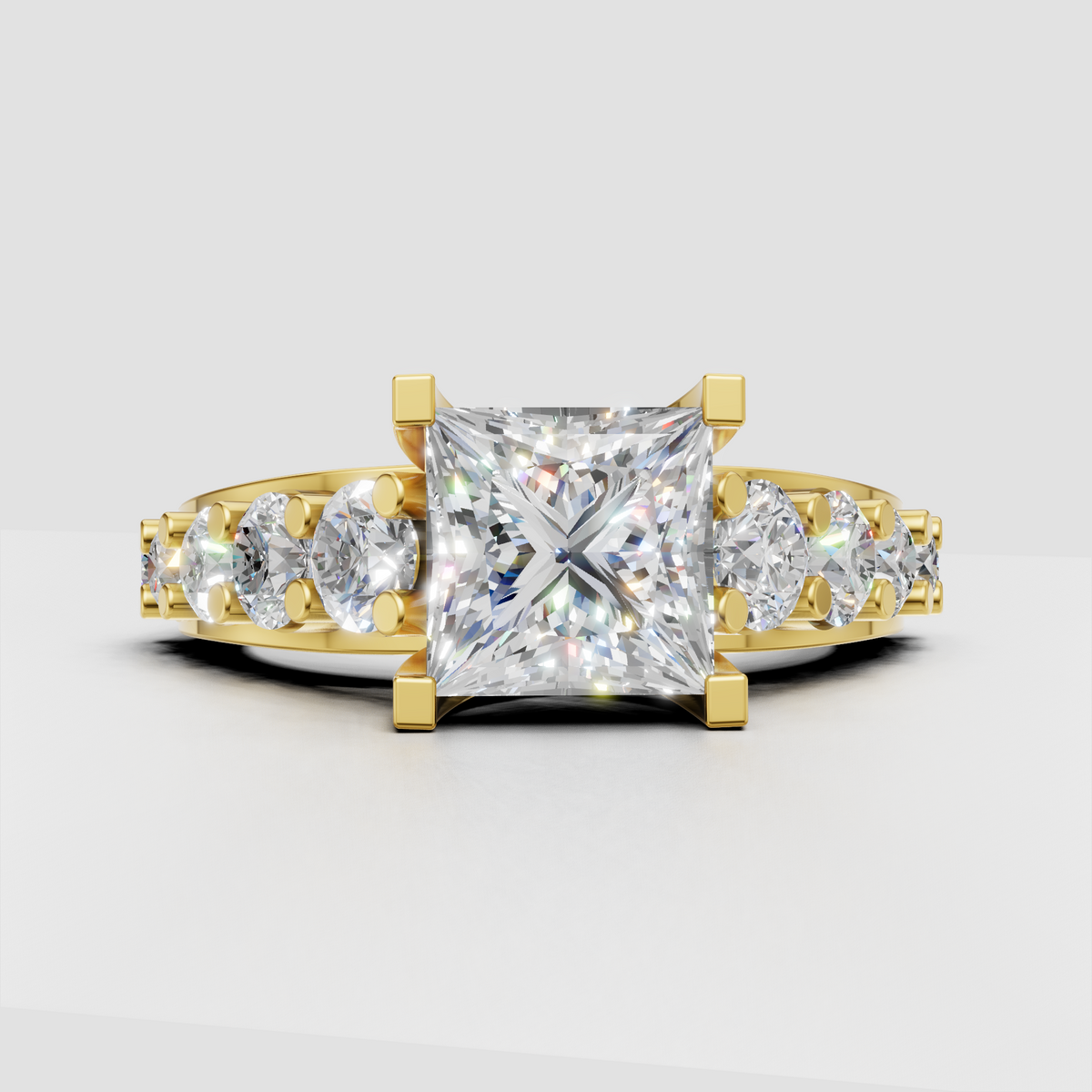 Princess diamond engagement ring with split shank and graduated round diamond accents