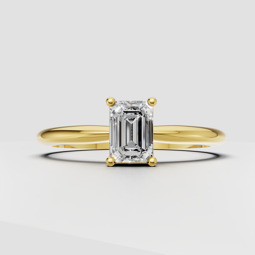 Emerald cut diamond solitaire engagement ring in polished yellow gold