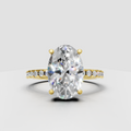 Oval diamond hidden halo solitaire engagement ring in polished yellow gold