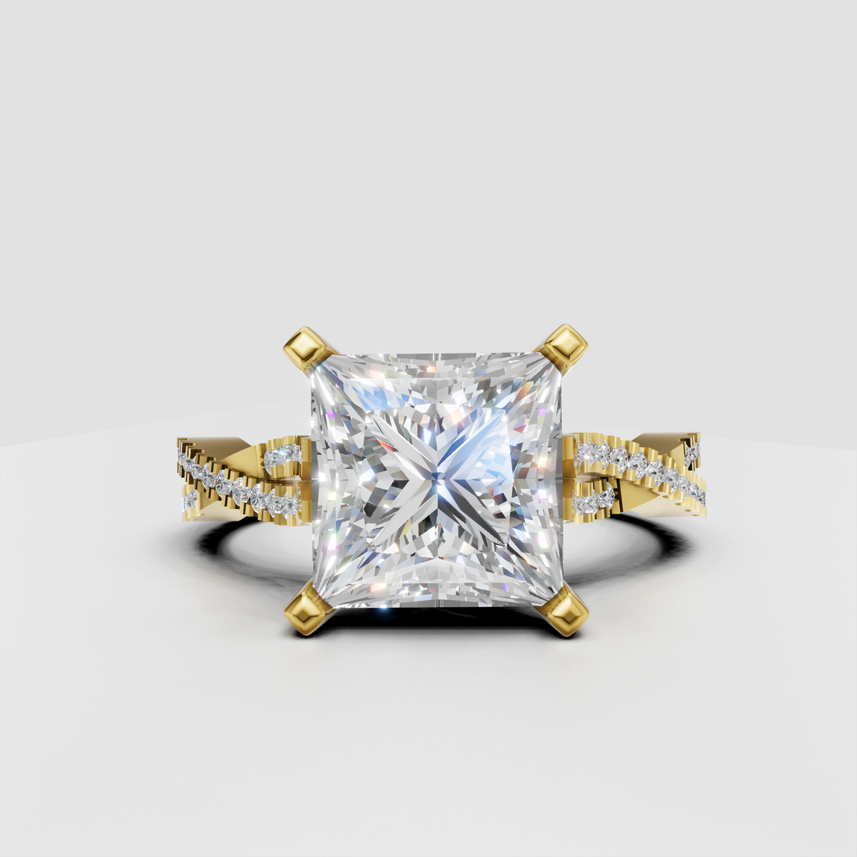 Princess-cut diamond engagement ring with four-prong gold setting and split-shank pave band
