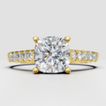 Cushion cut diamond four-prong pavé solitaire engagement ring in yellow gold