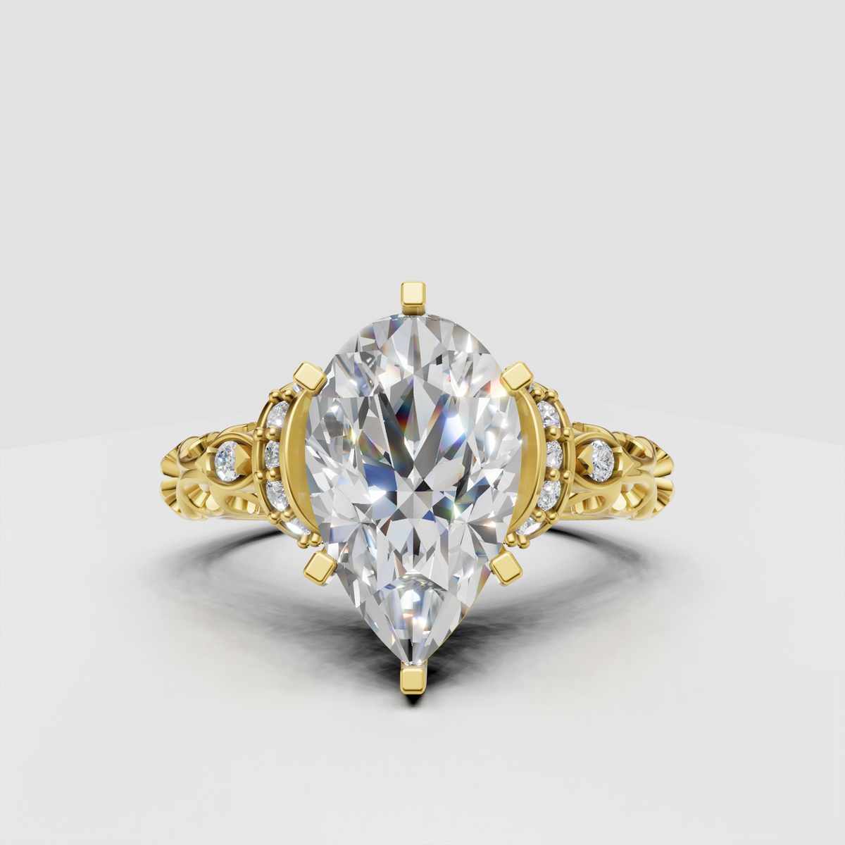 Pear cut diamond vintage filigree halo engagement ring in yellow gold
