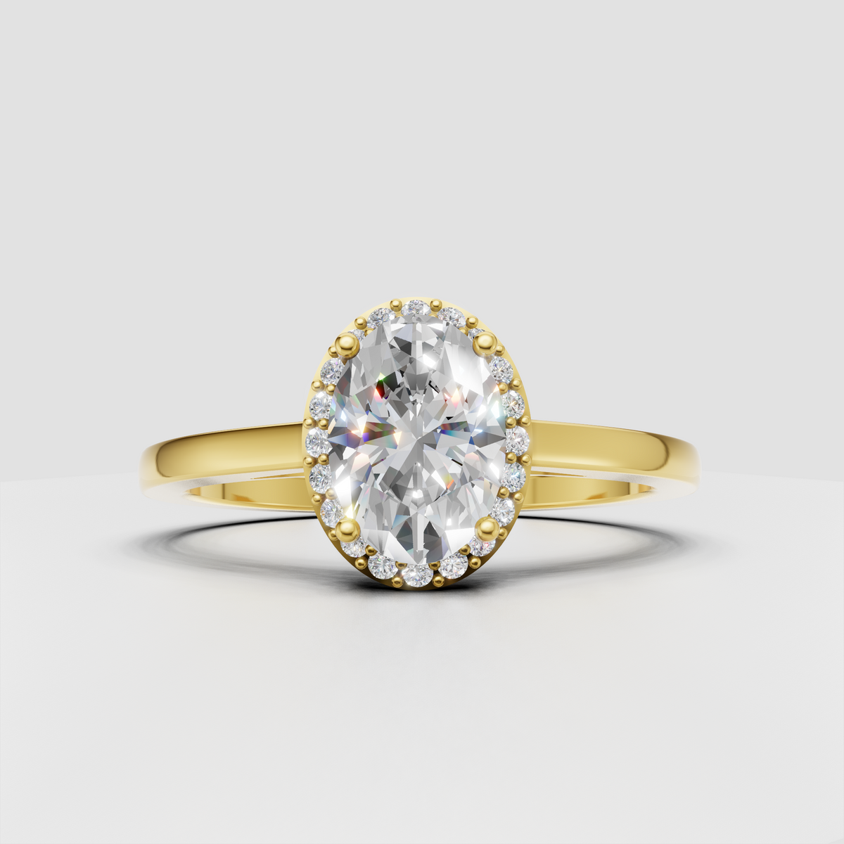 Oval diamond four-prong halo yellow gold engagement ring with round accent stones