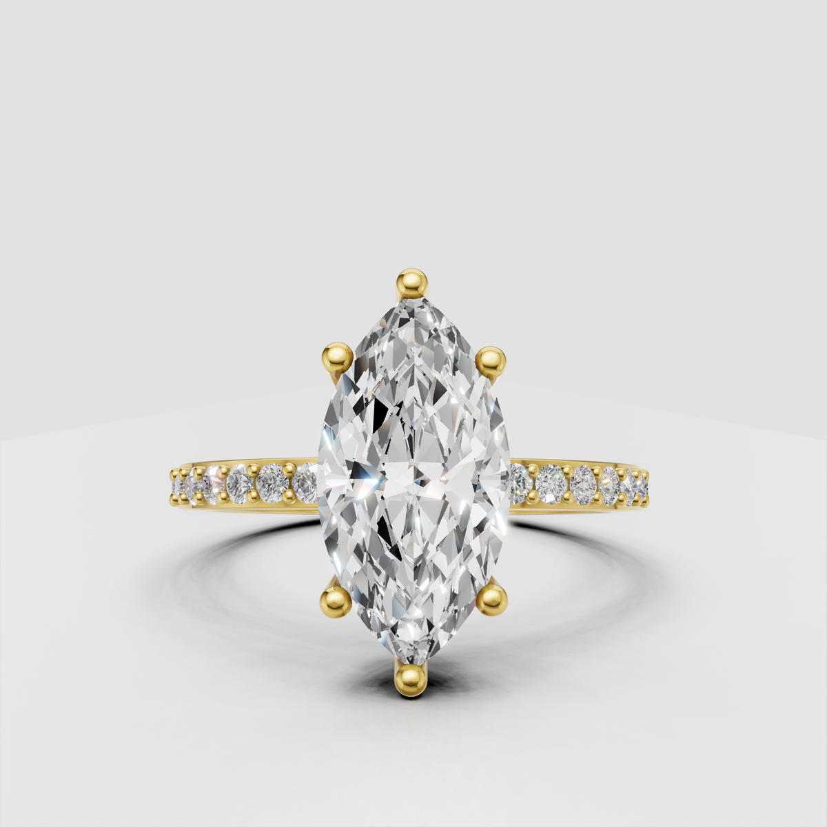 Marquise cut diamond cathedral engagement ring with pavé side stones in yellow gold