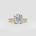Round cut diamond hidden halo engagement ring with pavé gold band