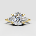 Round diamond three-stone nature inspired engagement ring