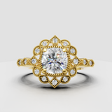 Cushion cut diamond floral halo engagement ring in yellow gold