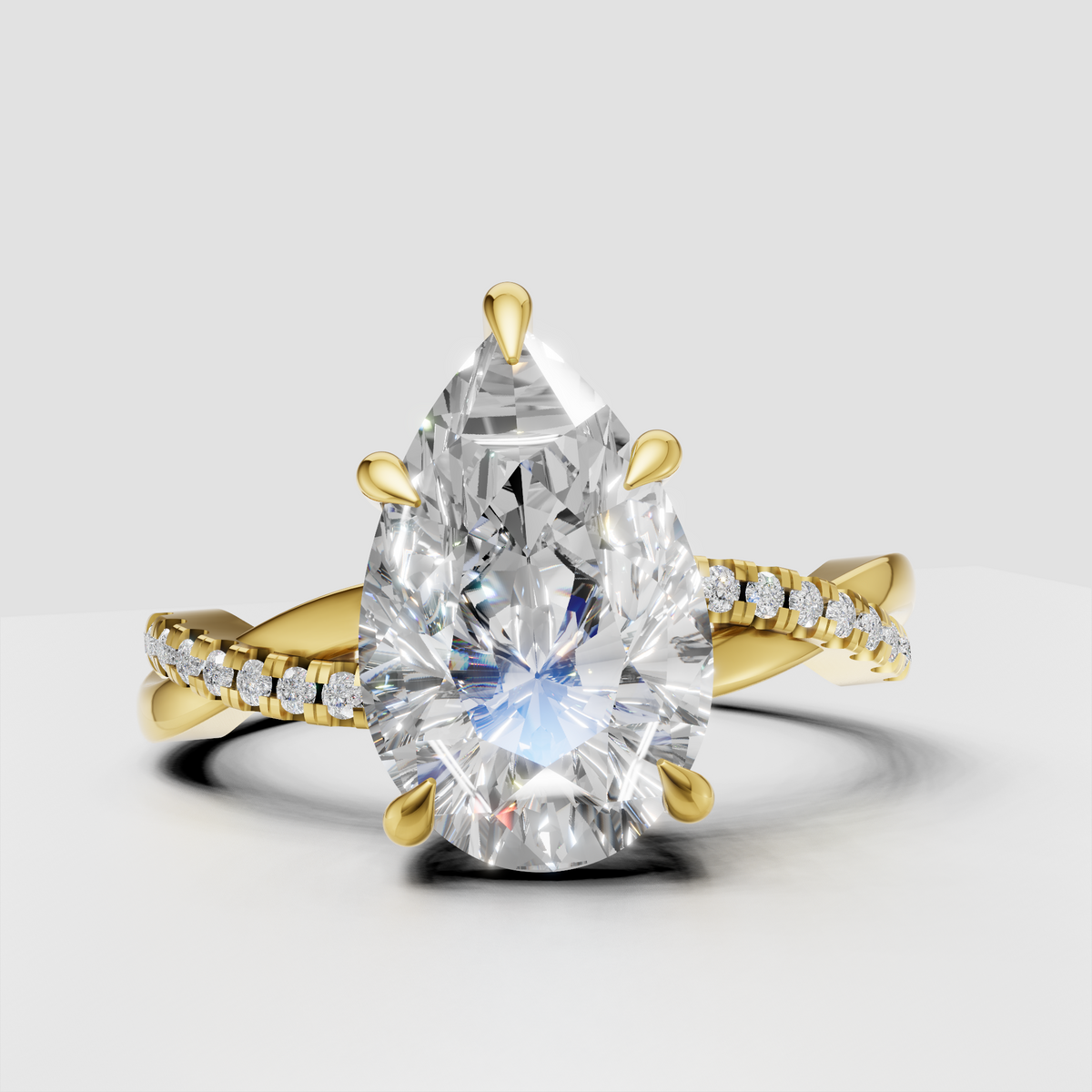 Pear diamond twisted engagement ring with pavé accents