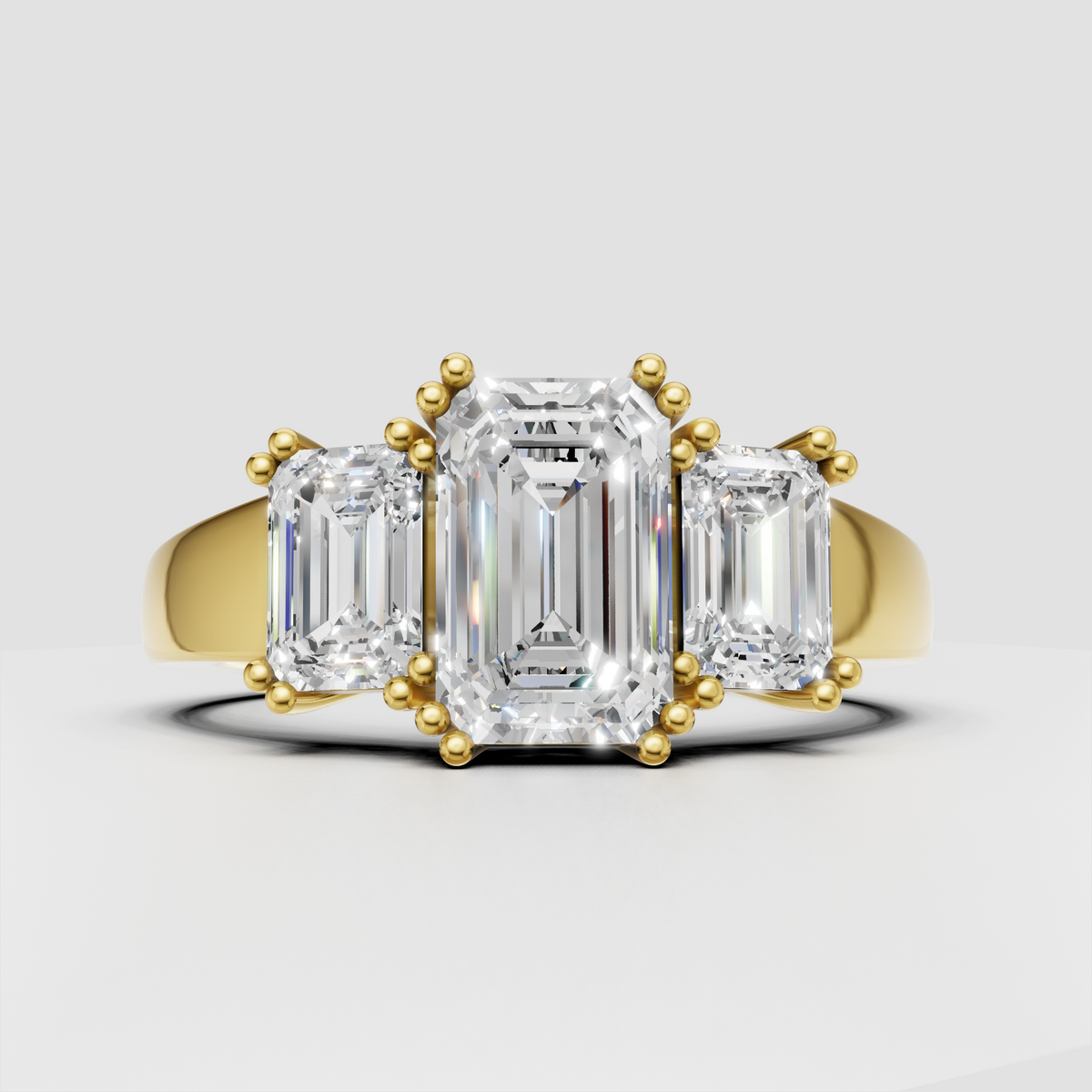 Emerald cut Diamond three stone engagement ring with polished band