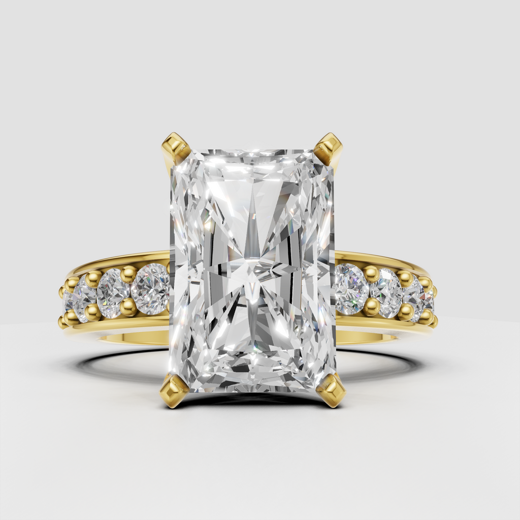 Radiant-cut diamond four-prong engagement ring with yellow-gold band and side stones