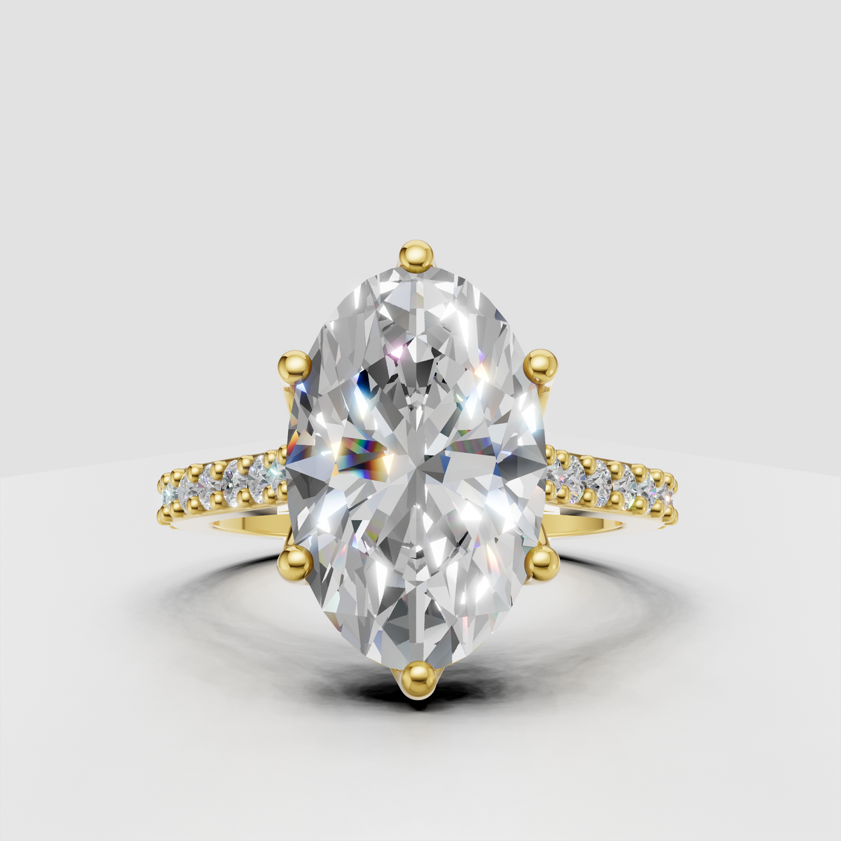 Oval diamond cathedral pavé engagement ring in polished yellow gold