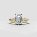Yellow gold emerald cut engagement ring with tapered baguette side stones