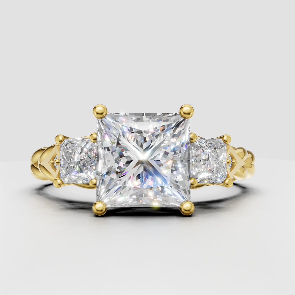 Princess cut diamond three stone vintage style ring in yellow gold