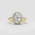 Elongated cushion cut diamond halo engagement ring in yellow gold with pavé band