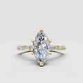 Marquise cut diamond cathedral engagement ring in yellow gold