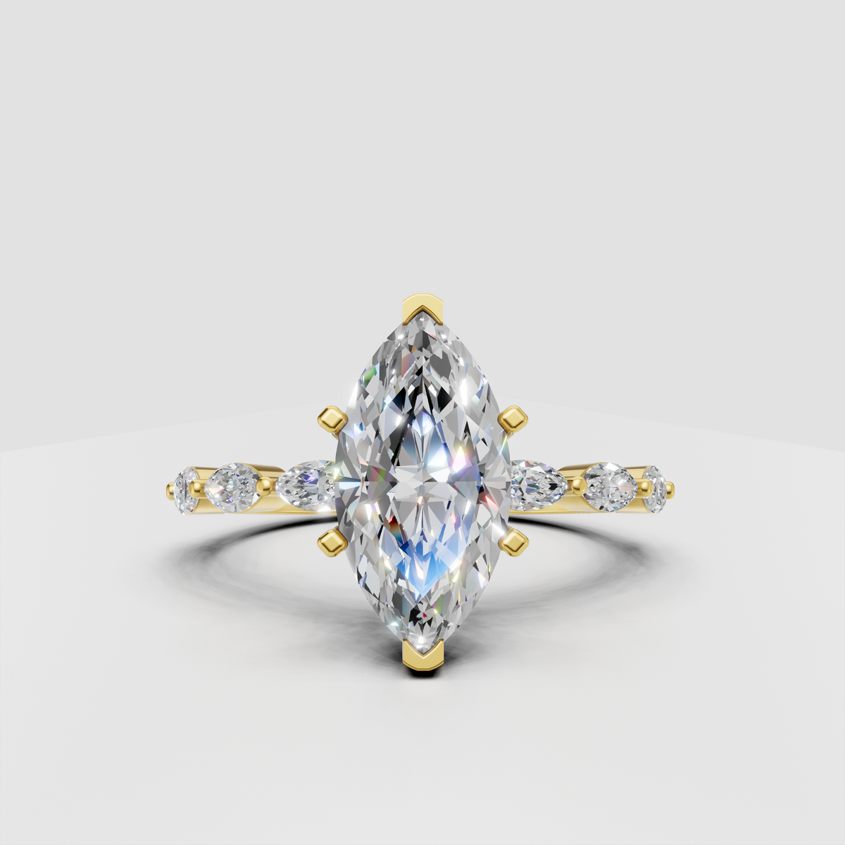 Marquise cut diamond cathedral engagement ring in yellow gold