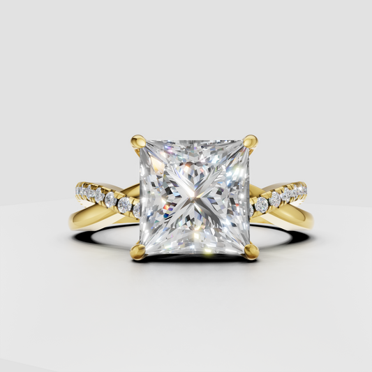 Princess cut diamond crossover pavé engagement ring in polished yellow gold