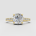 Round diamond four-prong cathedral engagement ring in polished yellow gold