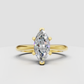 Marquise cut diamond solitaire plain band ring in yellow gold