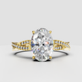 Pear diamond split shank engagement ring in polished yellow gold