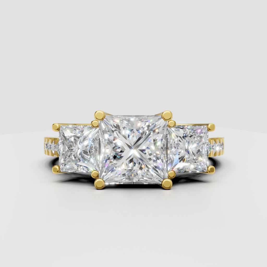 Princess cut three stone diamond engagement ring in yellow gold