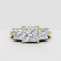 Princess cut three stone diamond engagement ring in yellow gold