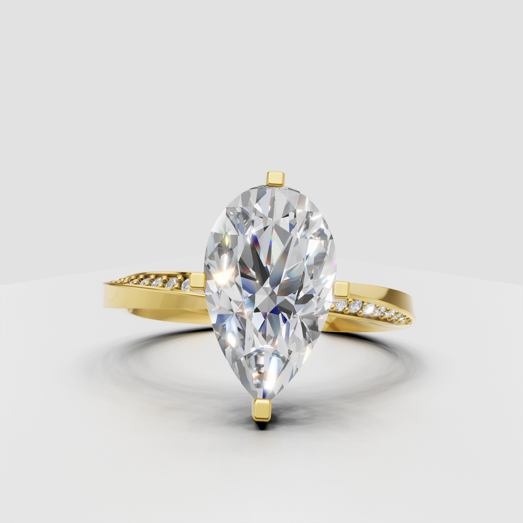 Yellow gold pear shaped diamond ring