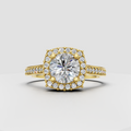 Round cut diamond halo engagement ring with pavé band in yellow gold