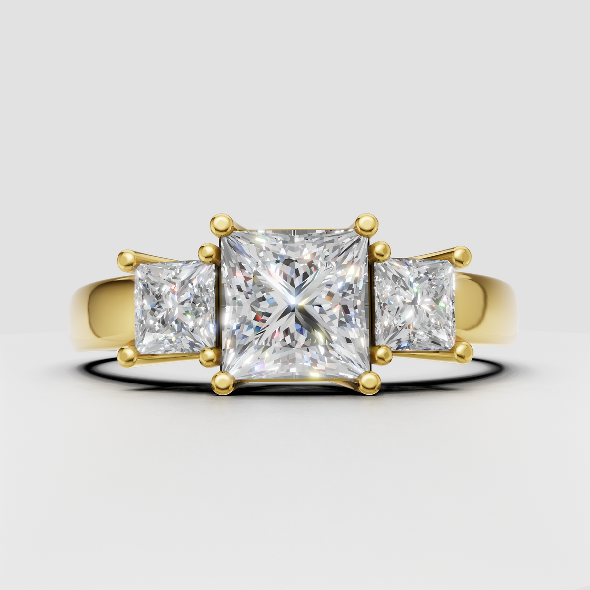 Princess cut diamond three stone engagement ring with prong setting