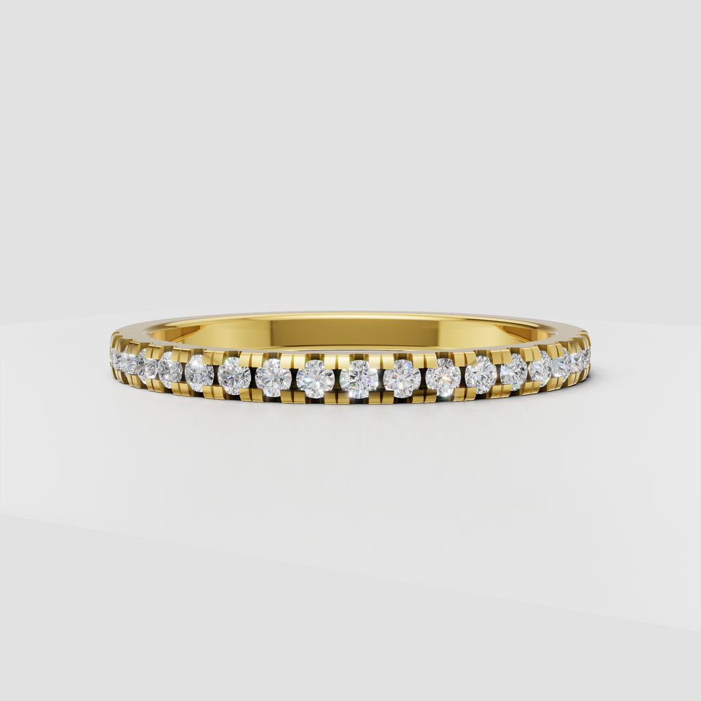 Round diamond channel setting half eternity band in polished yellow gold