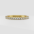 Round diamond channel setting half eternity band in polished yellow gold