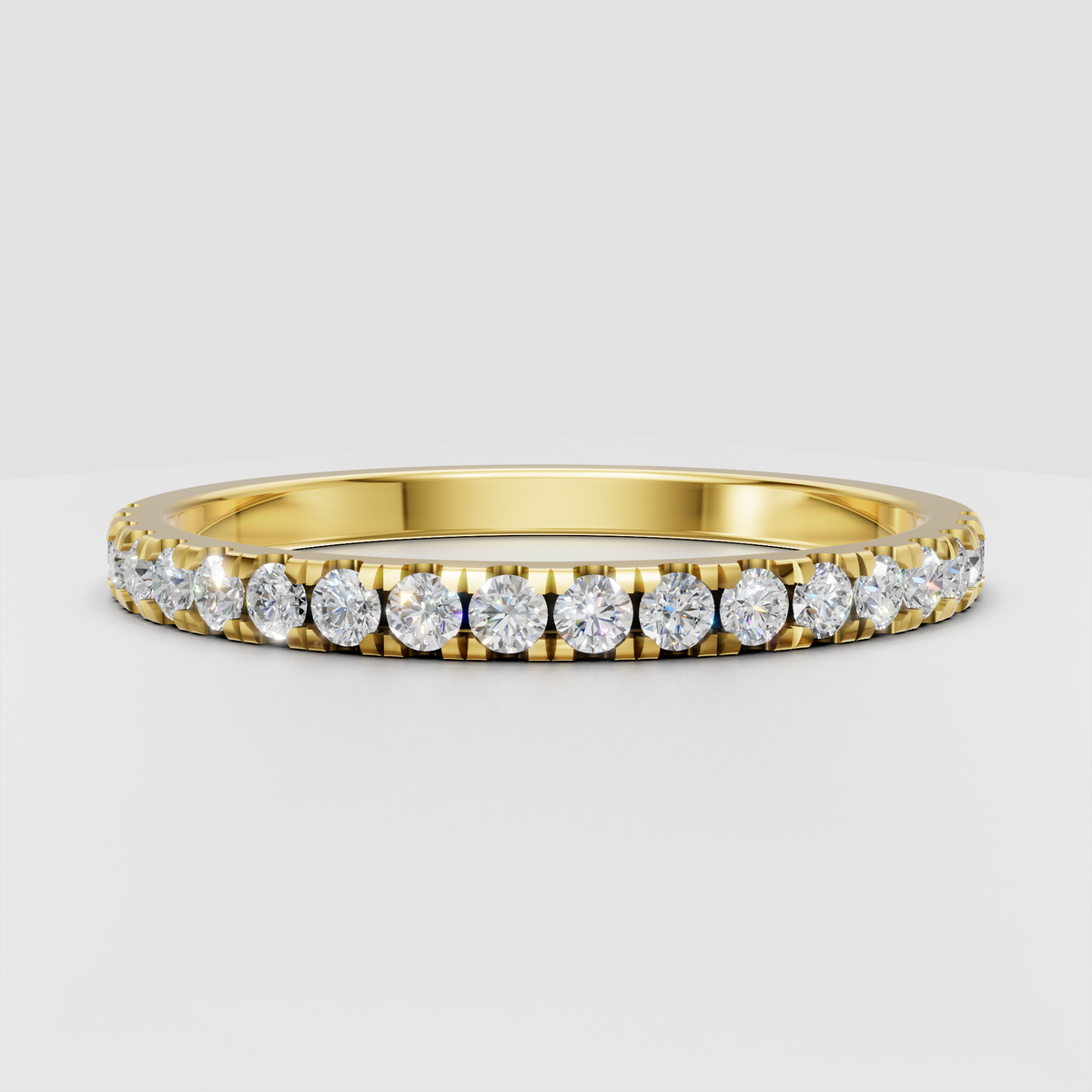 Round cut diamond half eternity wedding band in polished yellow gold
