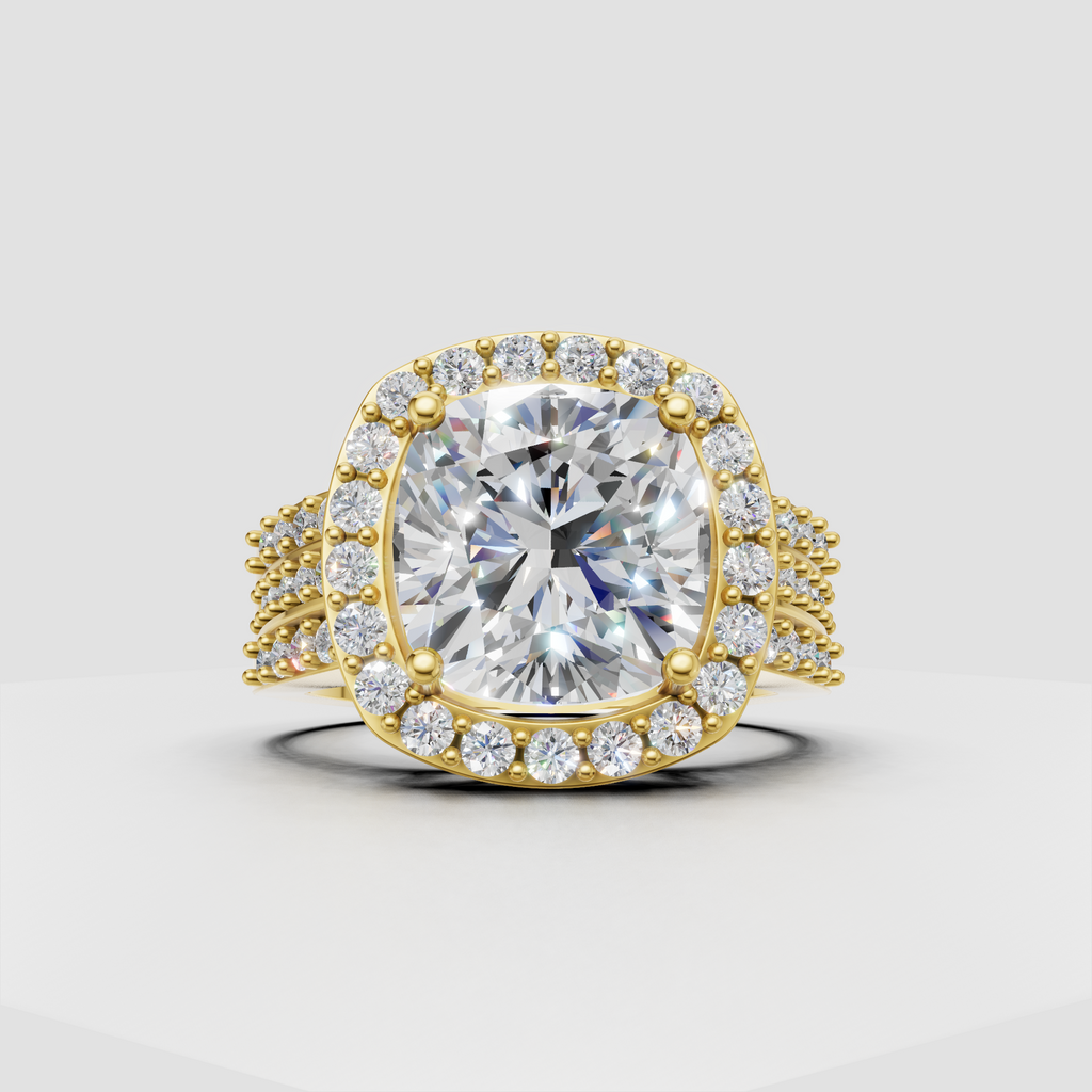 Cushion cut diamond halo engagement ring in polished yellow gold