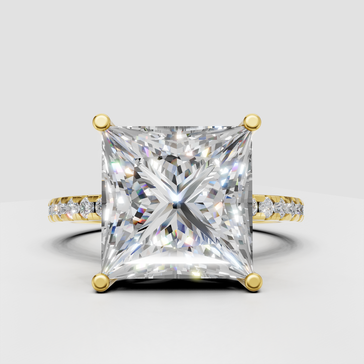 Princess cut diamond hidden halo solitaire engagement ring with pavé band in white gold.