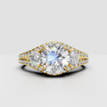 Round cut diamond three stone engagement ring in yellow gold