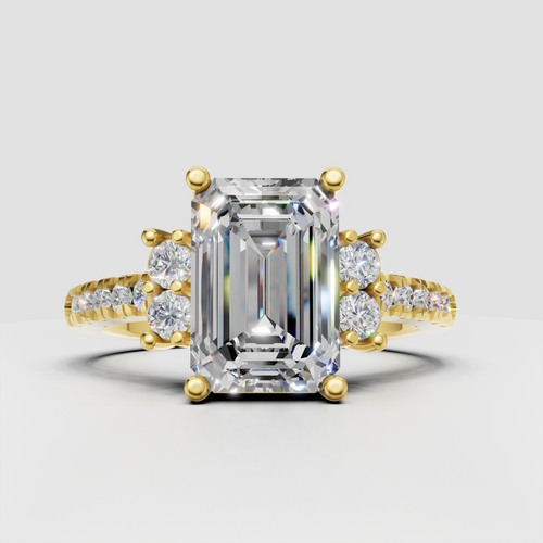 Emerald cut diamond cluster engagement ring with pave side stones