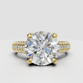 Round cut diamond vintage style engagement ring with pavé band in yellow gold