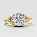 Round cut diamond solitaire engagement ring with leaf inspired split shank band