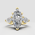 Marquise cut diamond three stone engagement ring with pear side diamonds