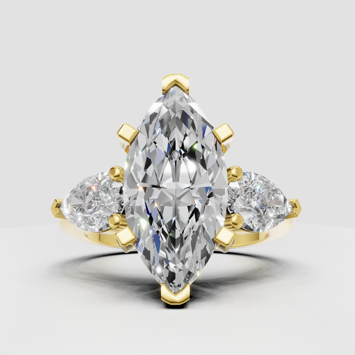 Marquise cut diamond three stone engagement ring with pear side diamonds