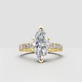 Marquise cut diamond solitaire with accent yellow gold engagement ring front view