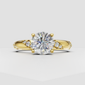 Round diamond cathedral pavé engagement ring in yellow gold