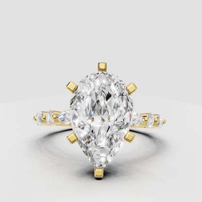 Pear diamond sculptural engagement ring in polished yellow gold