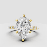 Pear diamond sculptural engagement ring in polished yellow gold