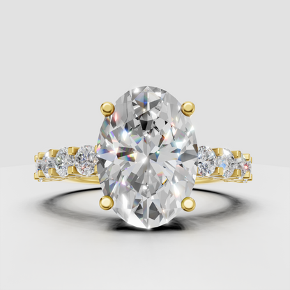 Pear cut diamond floral halo engagement ring in yellow gold