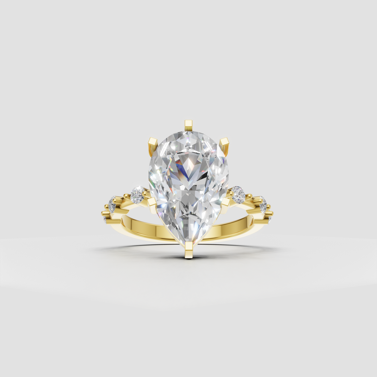 Pear cut diamond cathedral prong engagement ring with side stones