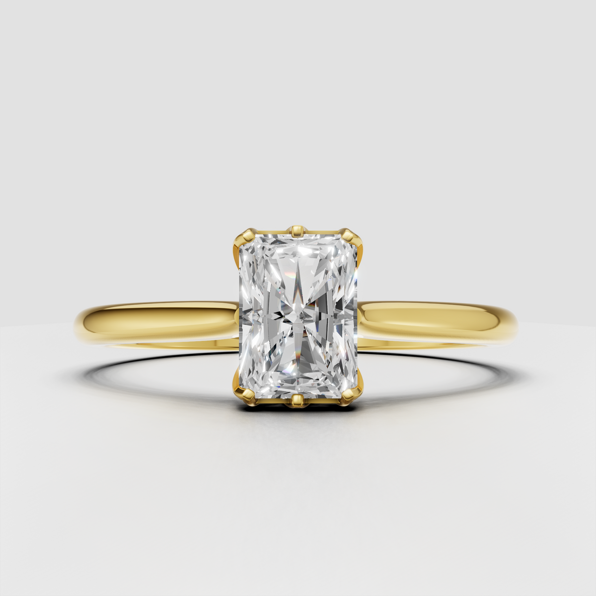 Radiant cut diamond cathedral solitaire engagement ring in polished yellow gold
