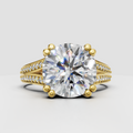 Round diamond engagement ring with double-row pavé split shank in yellow gold